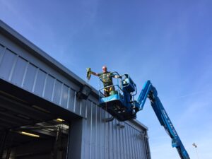 Commercial gutter clearance with mobile access equipment